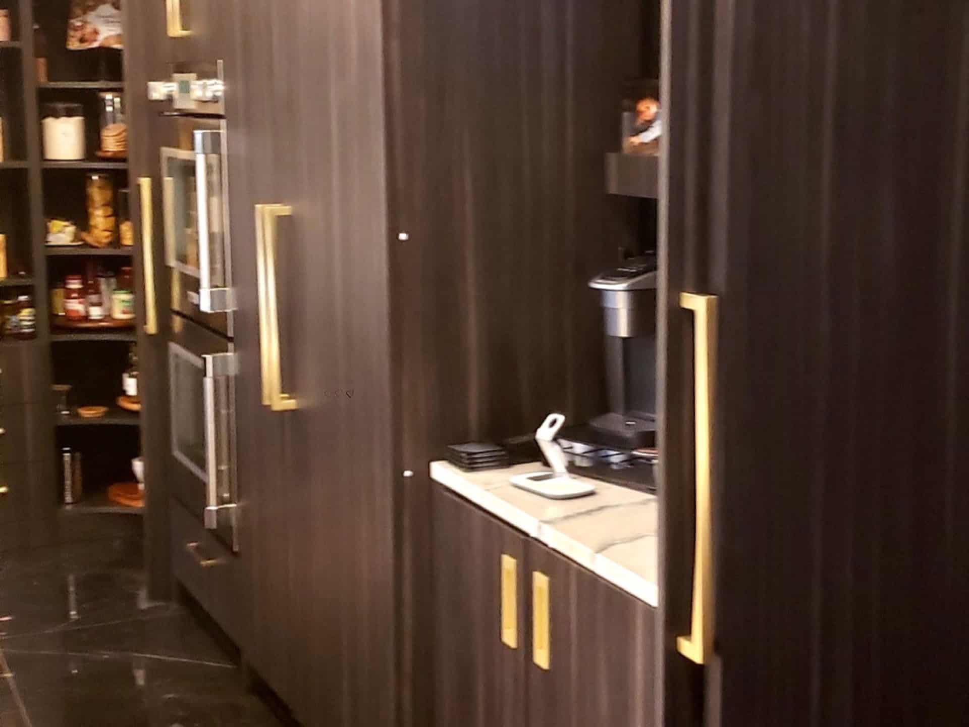Dark kitchen with custom cabinetry and pantry — remodeling by Yuriy